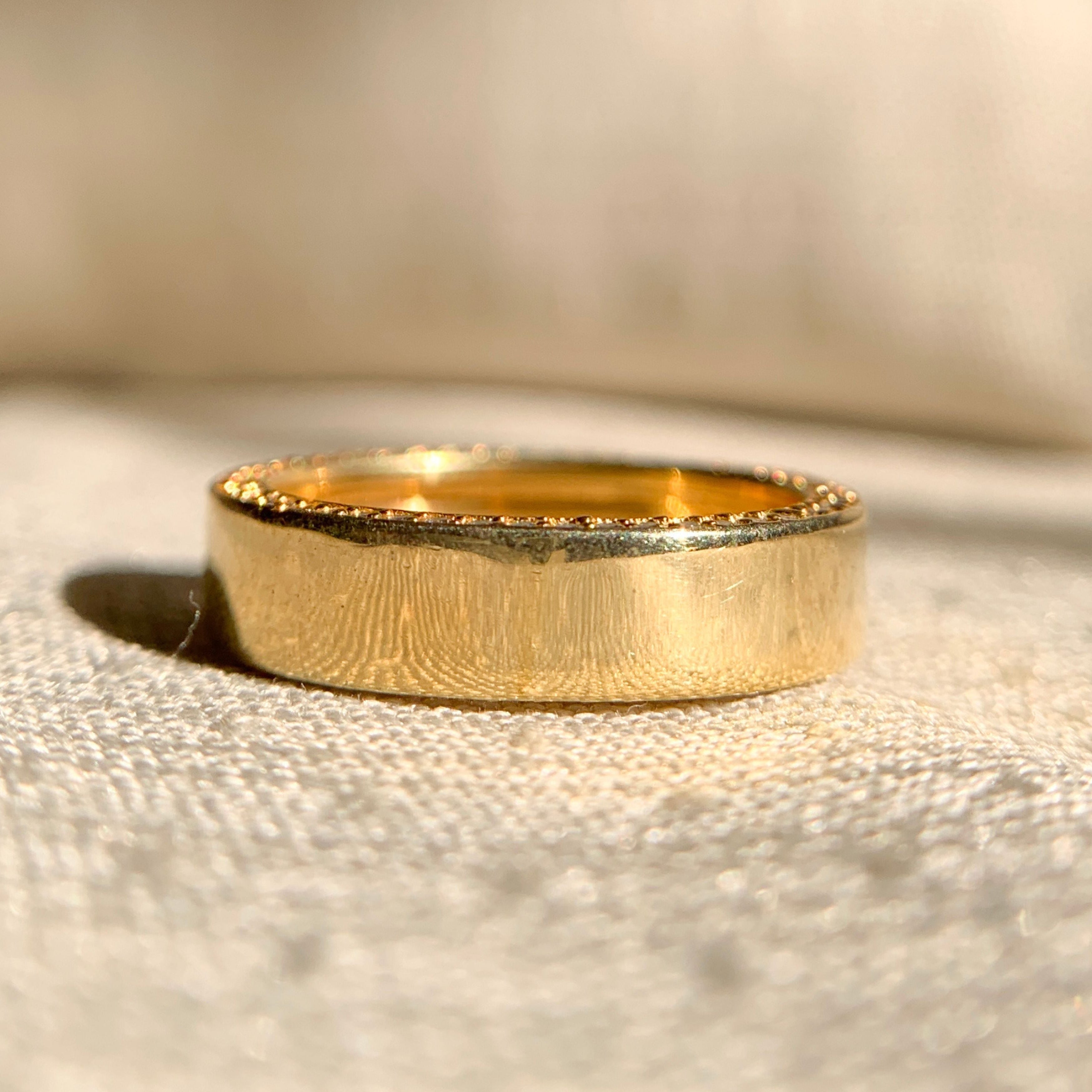 Classic ladies plain gold wedding band in polished finish